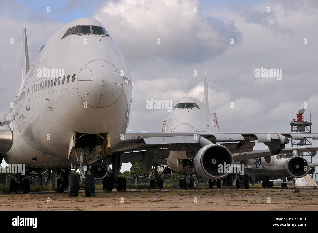 A group of retired jet airline planes stored and having had items removed. Often referred to as a boneyard, scrapping likely Stock Photo