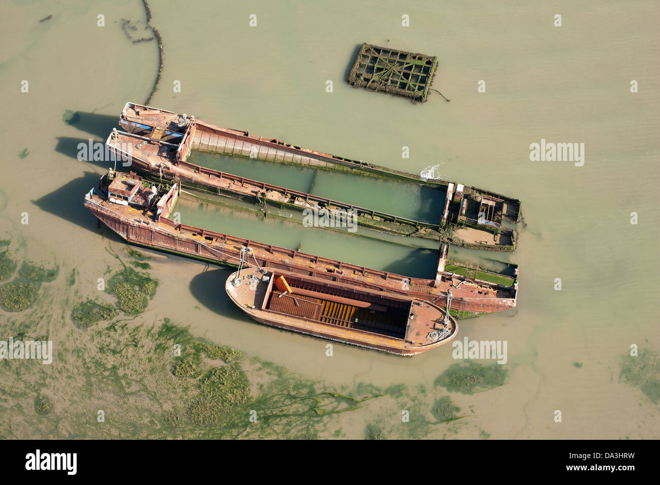 AERIAL VIEW. Rusted boats on the Thames Estuary. Isle of Sheppey, Kent, England, Great Britain, United Kingdom. Stock Photo