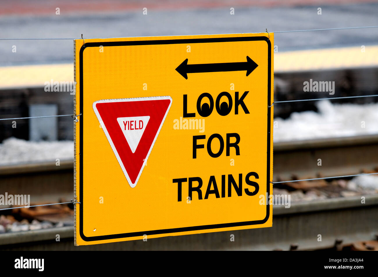 train warning sign pedestrian crossing at Metra station Elgin, Illinois, USA. Stock Photo