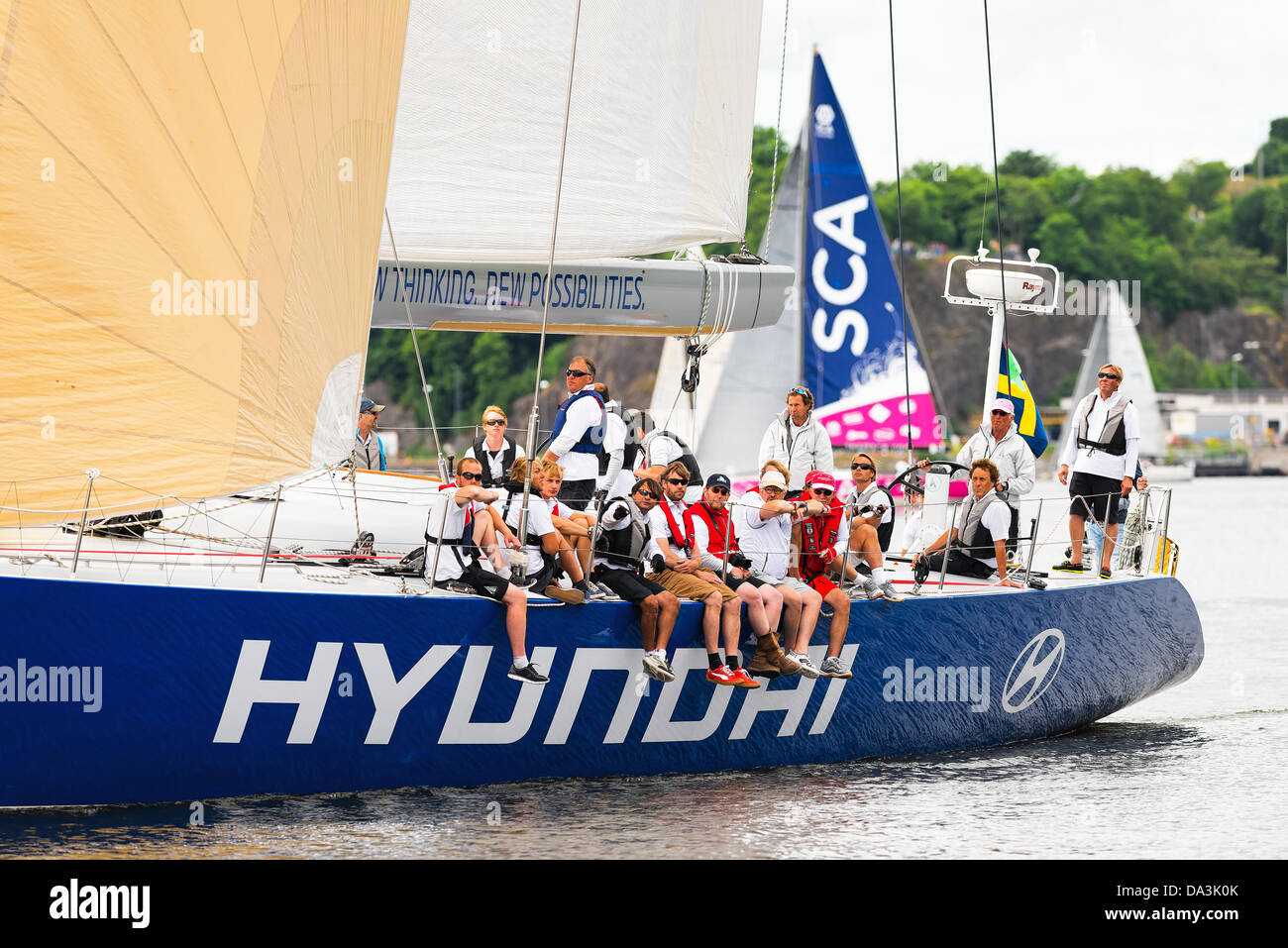 Stockholm, Sweden. 30th June, 2013. Sailboat Hyundai close to shore with crew and sailboat SCA in background departs from Stockholm in the ÅF Offshore Race (Gotland runt) class SRS A, June 30, 2013 in Stockholm, Sweden © Stefan Holm/Alamy Live News Stock Photo