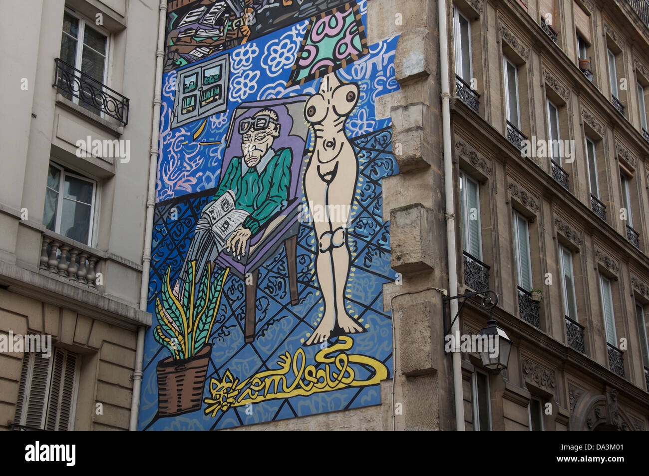 Parisian street art. La femme, la lumière de l’homme, Woman is the light of the man. A Mural by Robert Combas, in the Marais district of Paris. France. Stock Photo