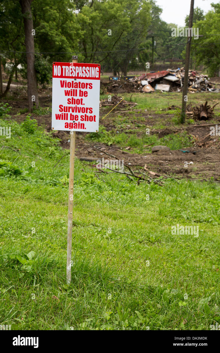 Detroit, Michigan - A sign on a vacant lot in the Brightmoor neighborhood warns that trespassers will be shot. Stock Photo