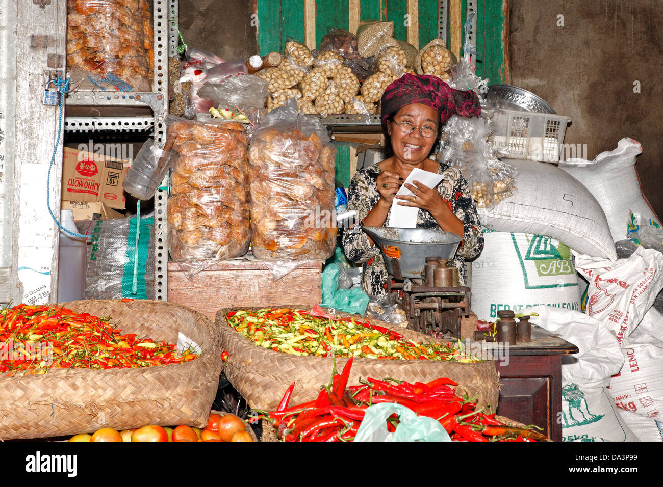 A Balinese woman shopkeeper at the traditional markets at Singaraja, north Bali, Indonesia Stock Photo