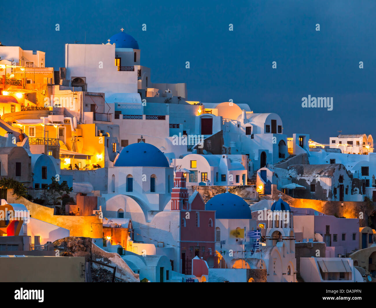 Night shot of houses and churches at Oia Santorini Greece Stock Photo