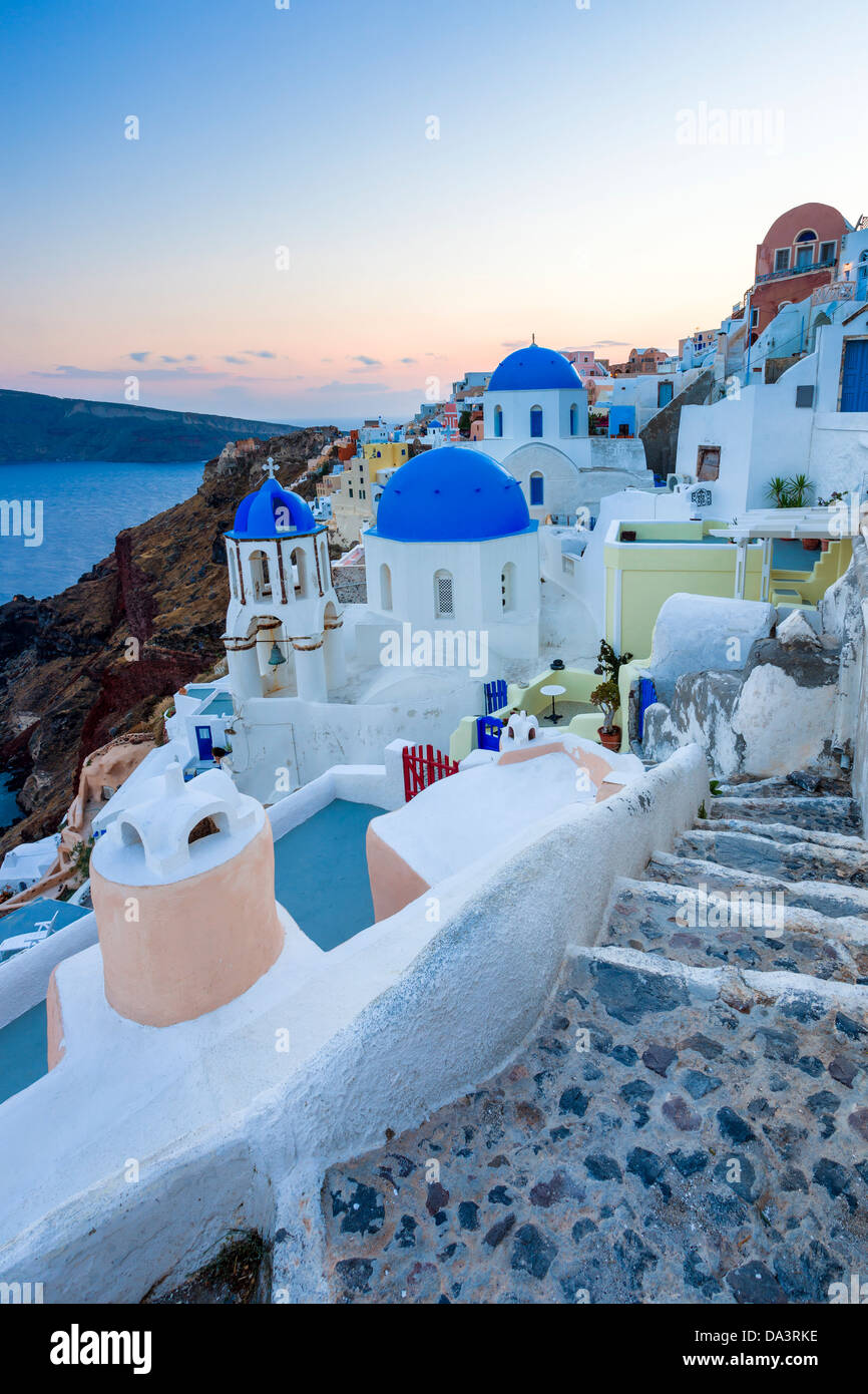 Dusk over blue domed churches at Oia Santorini Greece Stock Photo