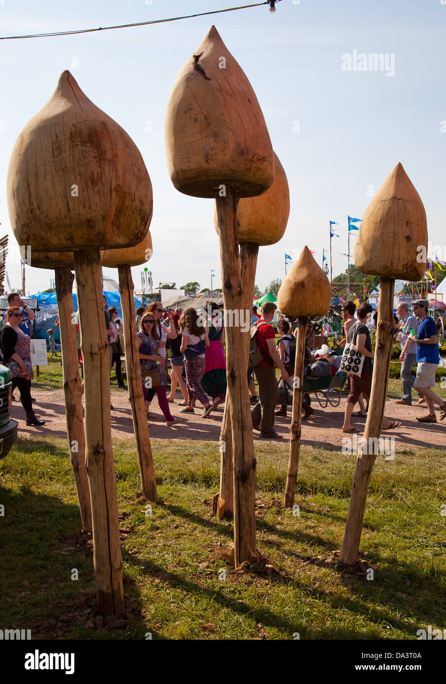 Giant carved wooden mushrooms at Glastonbury Festival of Contemporary