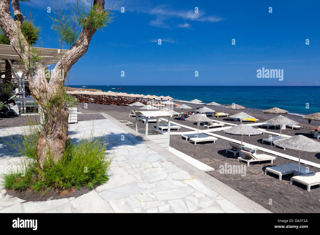 Parasols on Kamari Beach Santorini Greece Stock Photo