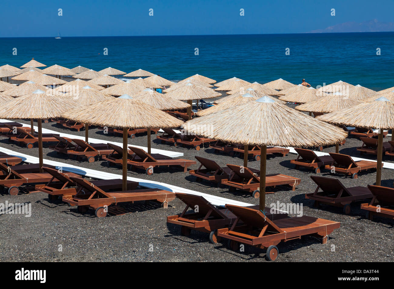 Parasols on Kamari Beach Santorini Greece Stock Photo