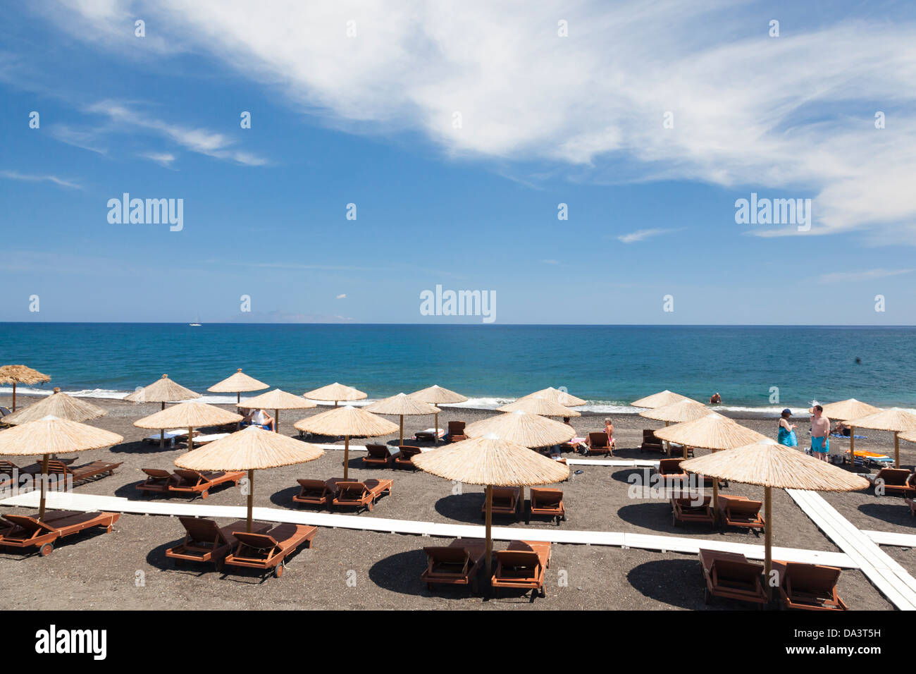 Parasols on Kamari Beach Santorini Greece Stock Photo