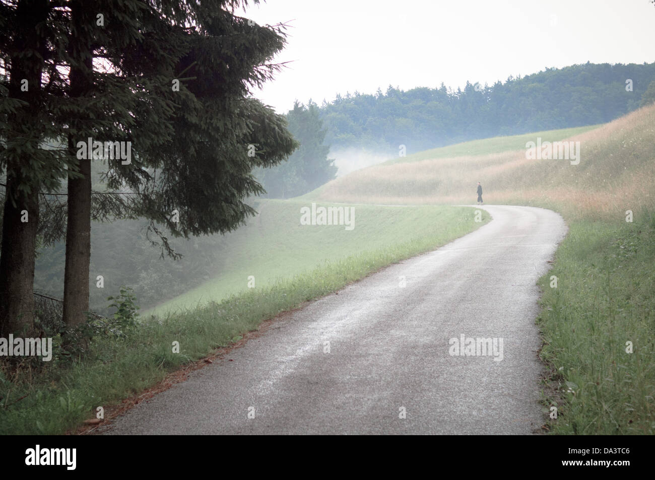 Woman walking uphill hi-res stock photography and images - Alamy