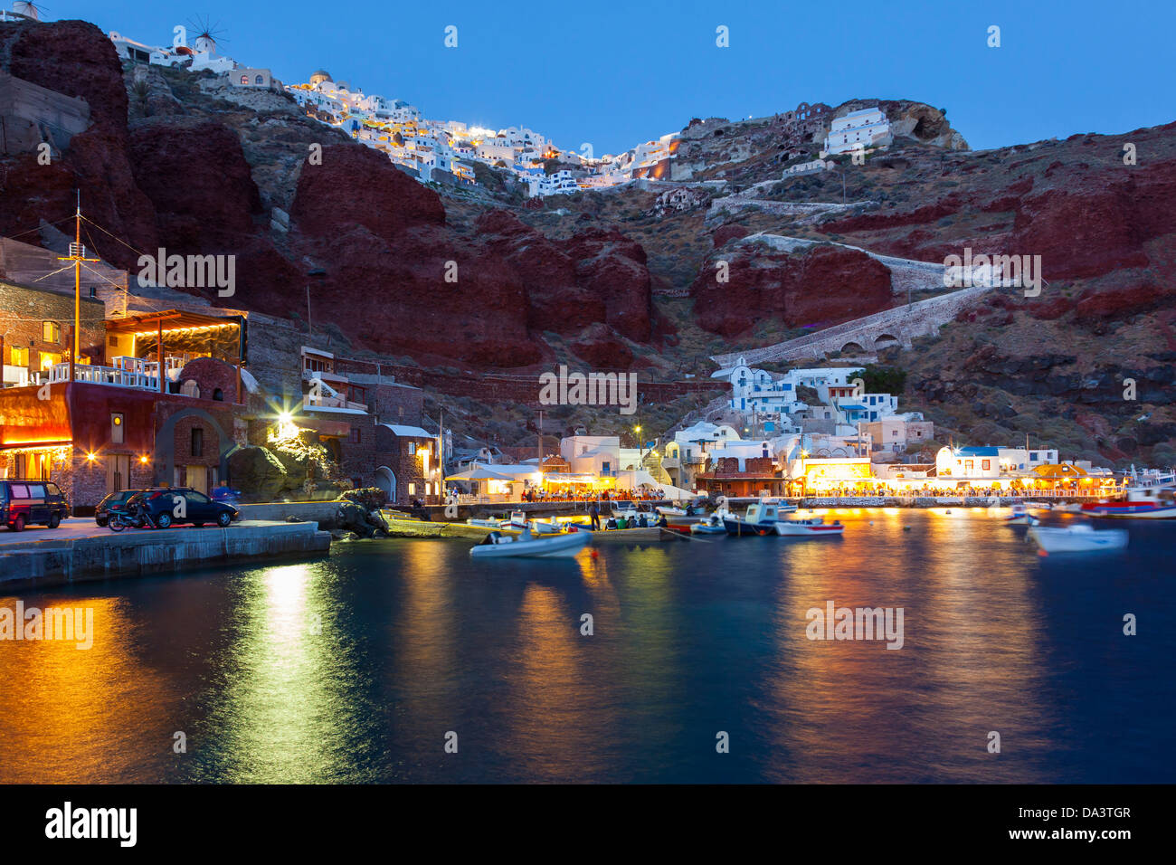 Night shot of Ammoudi Bay with Oia Santorini Greece above. Stock Photo