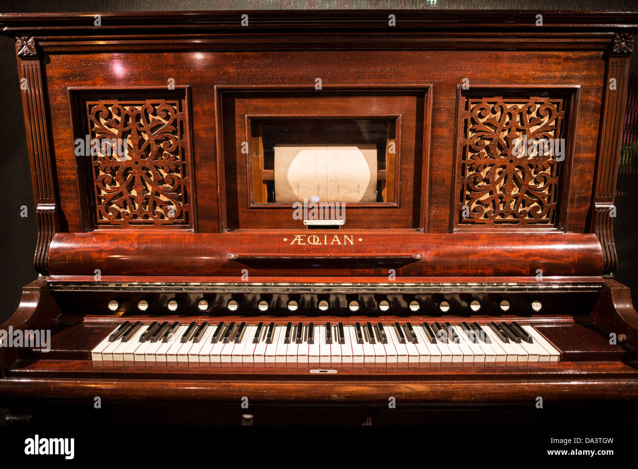 BRUSSELS, Belgium - A harmonium built by the Aeolian Organ and Music Co in New York around 1890 on display in the Musical Instrument Museum in Brussels. The Musee des Instruments de Musique (Musical Instrument Museum) in Brussels contains exhibits containing more than 2000 musical instruments. Displays include historical, exotic, and traditional cultural instruments from around the world. Visitors to the museum are given handheld audio guides that play musical demonstrations of many of the instruments. The museum is housed in the distinctive Old England Building. Stock Photo