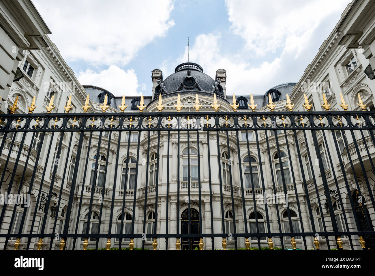 BRUSSELS, Belgium - A black and gold fence protects a building in the royal quarter of Brussels, Belgium. Stock Photo
