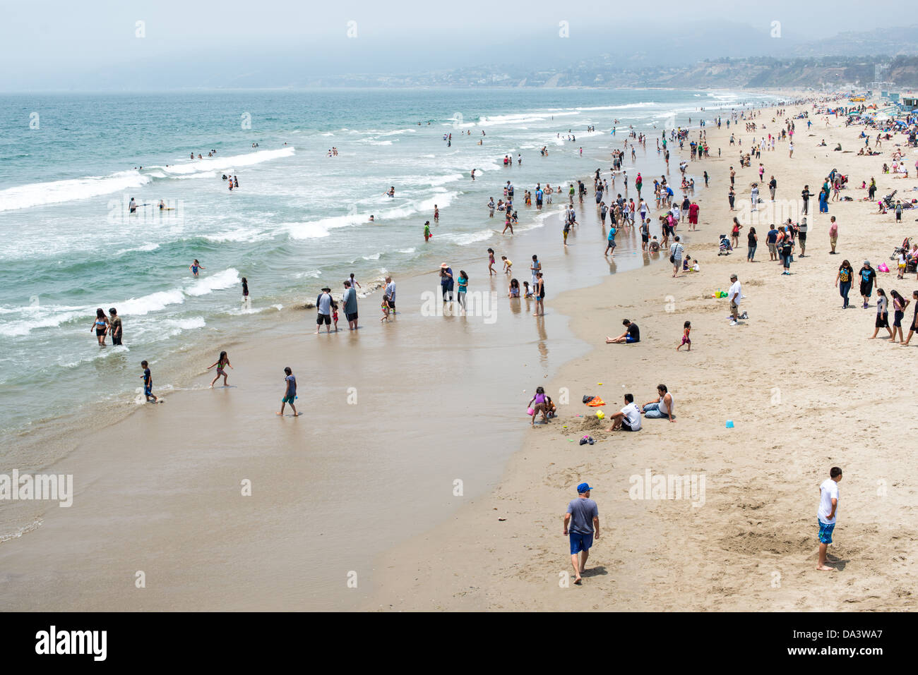 People enjoy the warm summer weather at Santa Monica beach in west Los Angeles, California. Stock Photo
