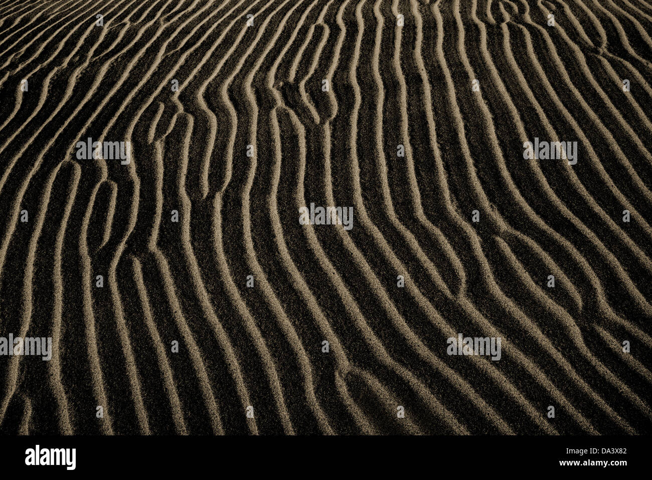 A Dark Sand Ripple Nature Background, Death Valley, California, USA Stock Photo