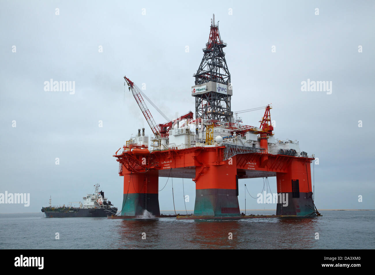 Oil Rig and tender ship, Walvis Bay, Namibia, Africa Stock Photo