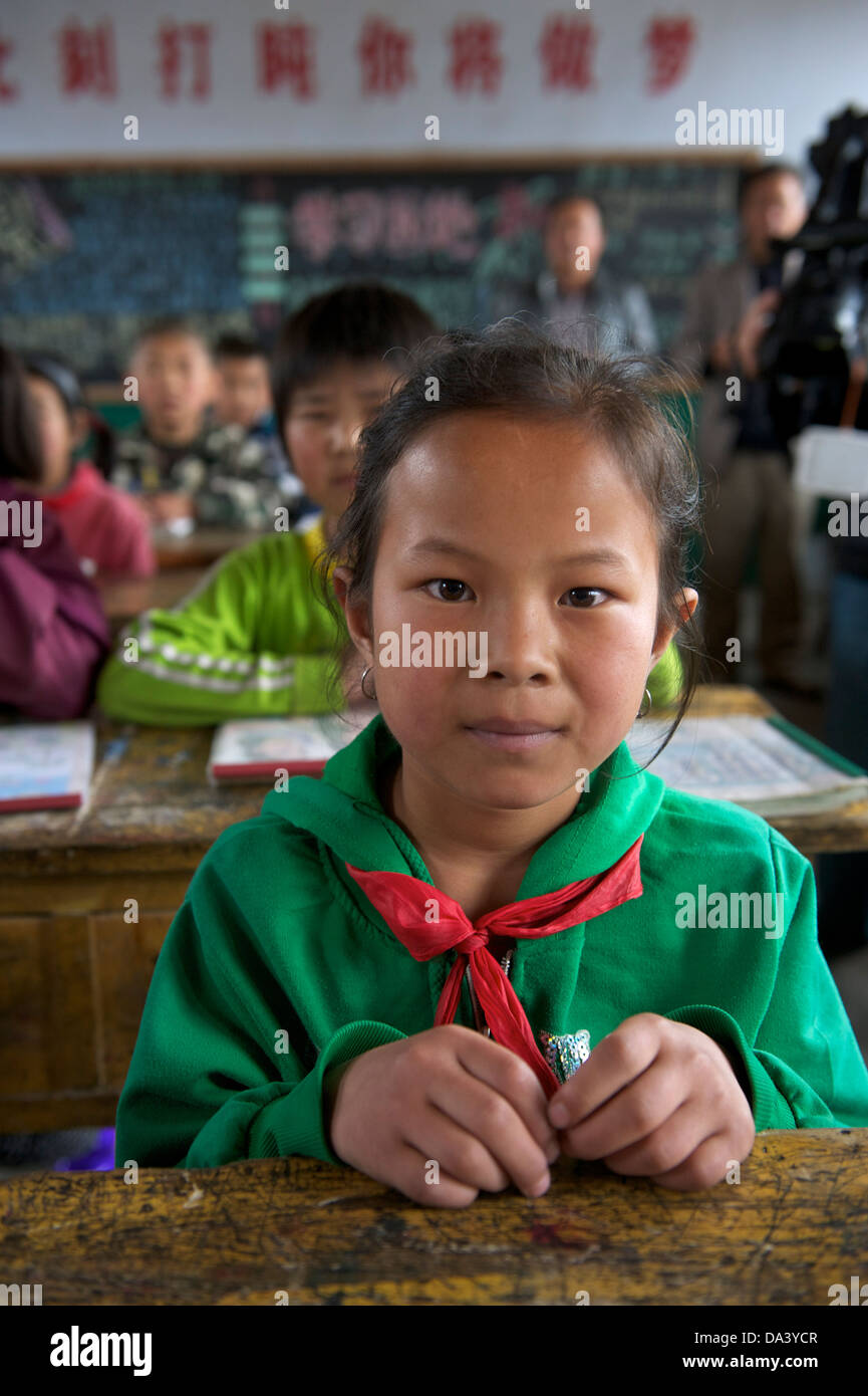 A girl student takes class at classroom in Haiyuan, Ningxia Hui Autonomous Region in China. 21-May-2013 Stock Photo