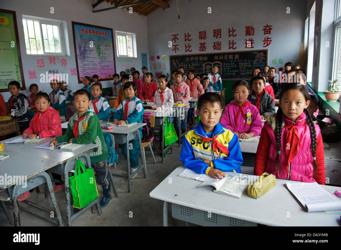 Primary school students stand up in classroom in Haiyuan, Ningxia Hui