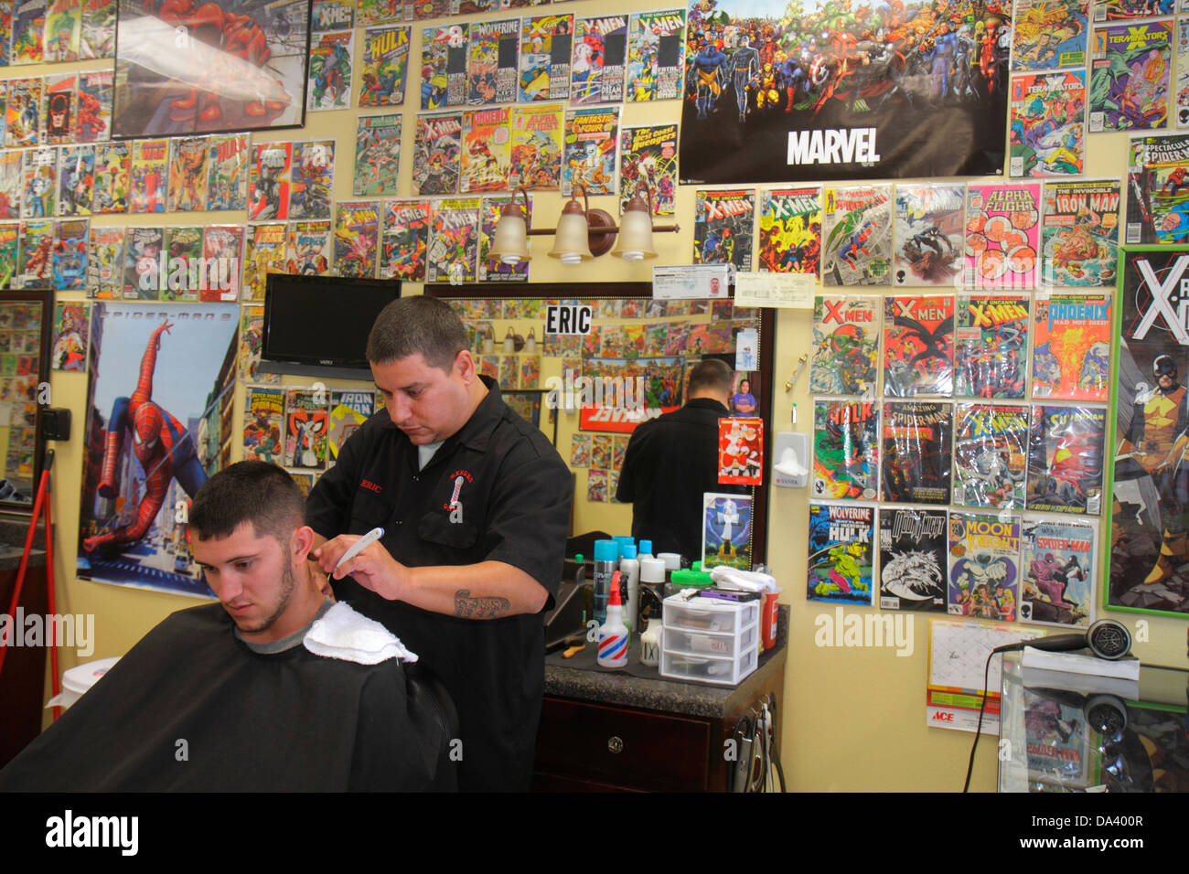 Florida Lithia,Heroes Only Barber Shop,haircut,cutting hair,man men male  adult adults,customer,comic books,book covers,collectibles,stylist,men's,chai  Stock Photo - Alamy