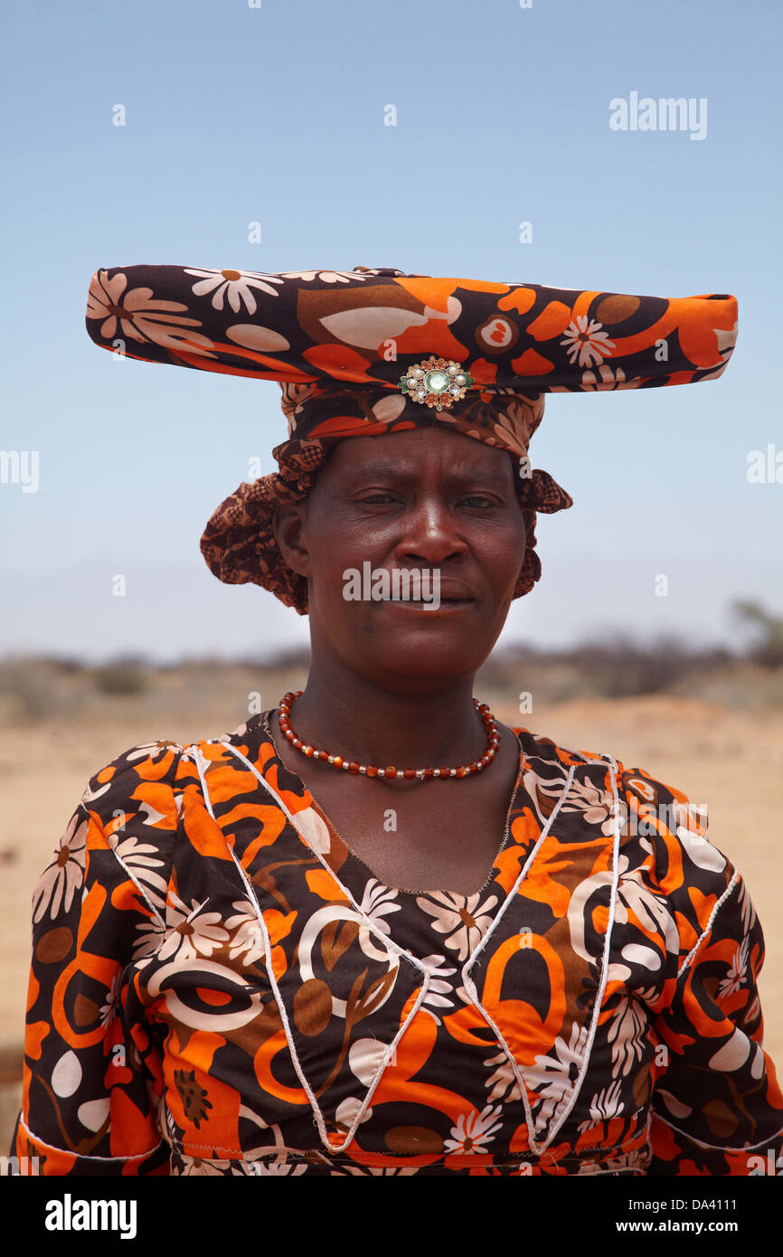 Herero woman in traditional dress, near Uis, Namibia, Africa Stock Photo