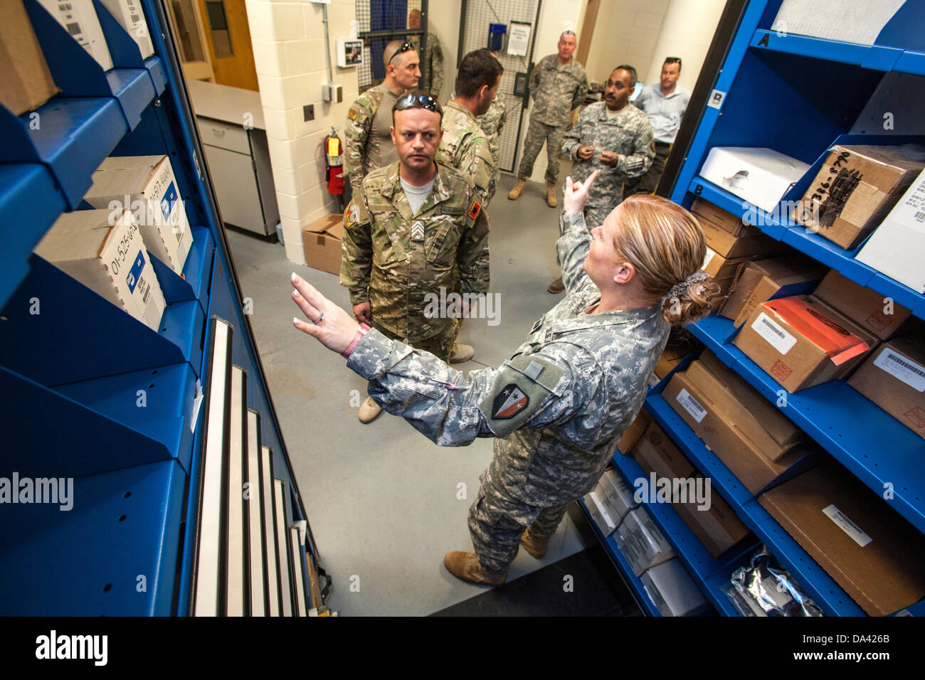 Capt. Jennifer M. Johnston, right, New Jersey Army National Guard, explains how the mobile aisle system tool and parts container Stock Photo