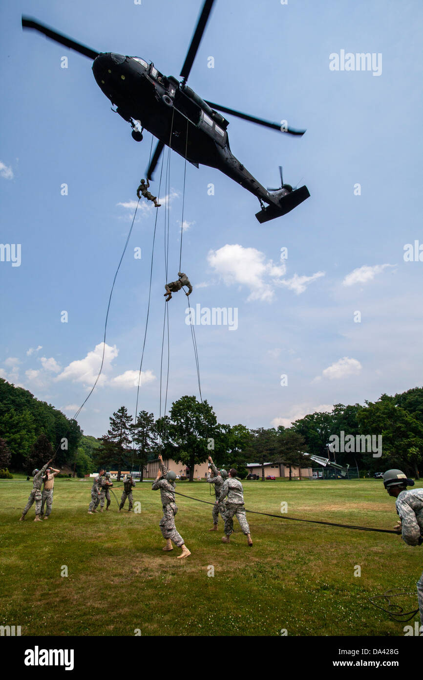 National Guard NJNG UH-60 Black Hawk Black Hawk rappelling Soldier Soldiers Stock Photo