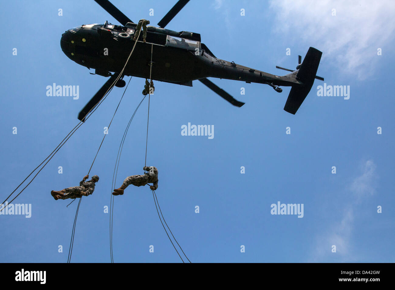 National Guard NJNG UH-60 Black Hawk Black Hawk rappelling Soldier Soldiers Stock Photo