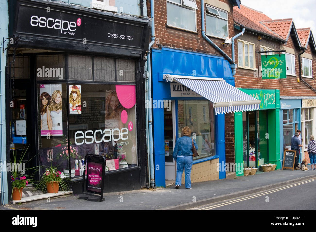 Traditional local shops and shoppers on Finkle Street Malton North