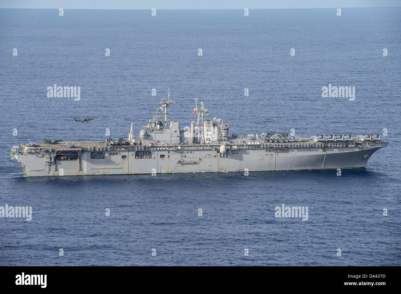 AV-8B Harrier aircraft prepares to land aboard the amphibious assault ship USS Bonhomme Richard (LHD 6). Bonhomme Richard is th Stock Photo