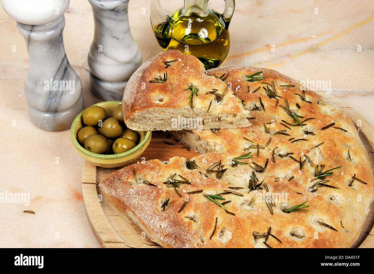 Traditional Italian rosemary Focaccia bread with green olives Stock