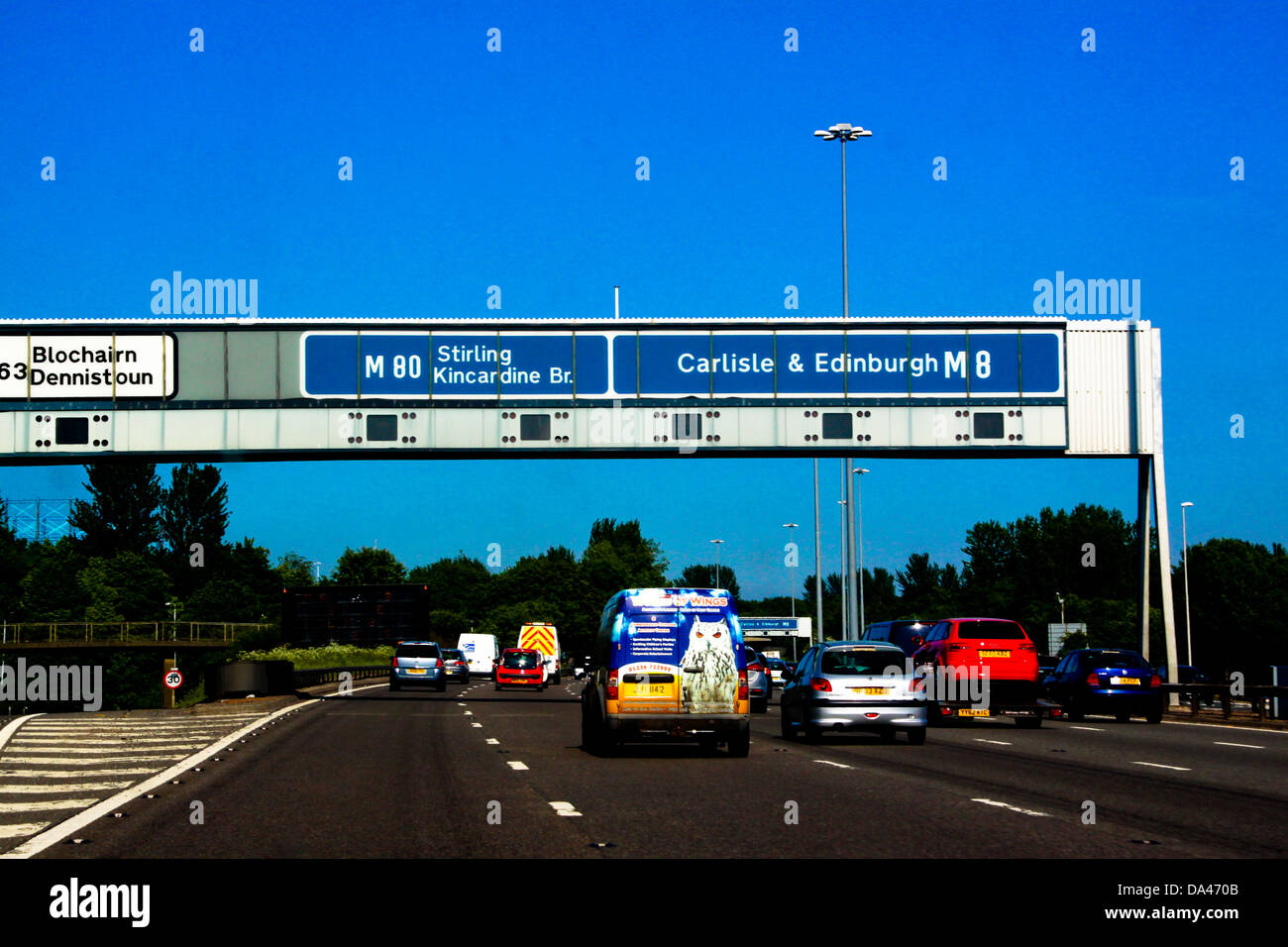 Overhead sign gantry on M8 motorway Glasgow Stock Photo