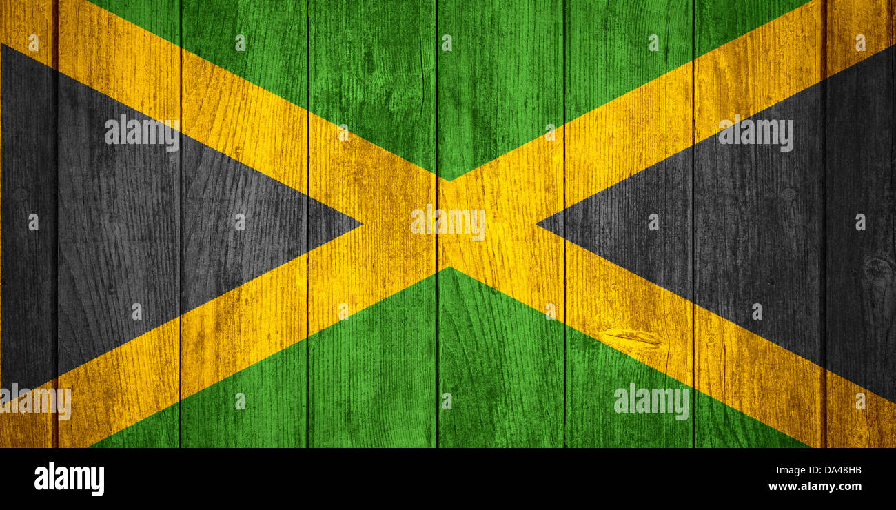 flag of Jamaica or Jamaican banner on wooden background Stock Photo