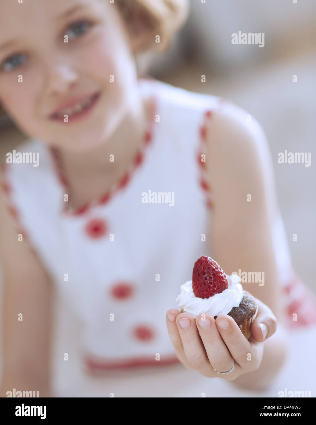 Young girl holding cup cake Stock Photo Alamy
