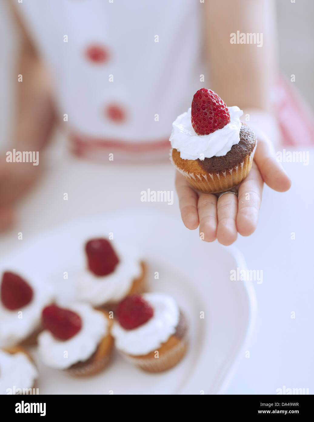 Young girl holding cup cake Stock Photo Alamy