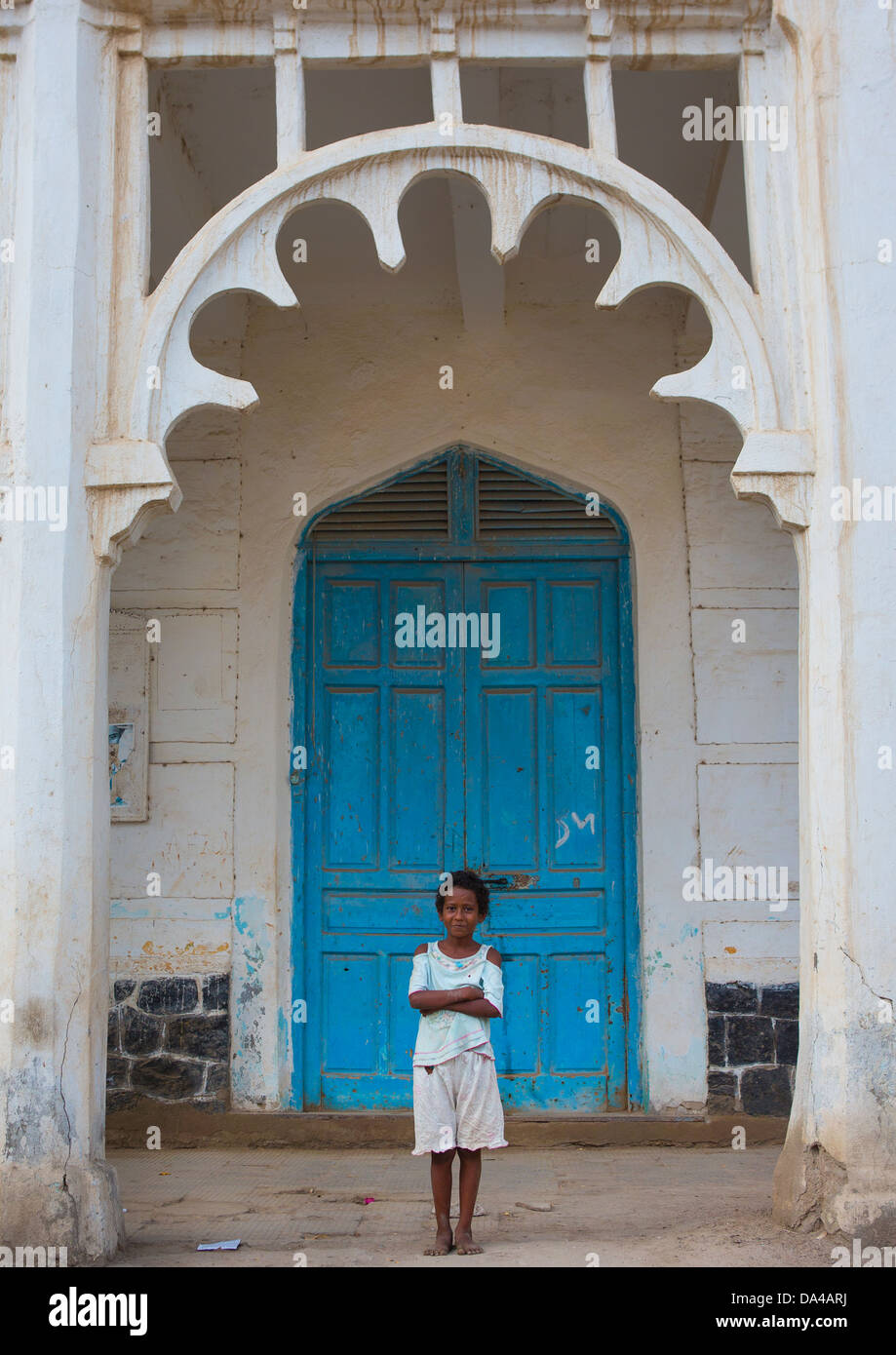 Child Standing In Front Of An Ottoman Architecture Building, Massawa, Eritrea Stock Photo