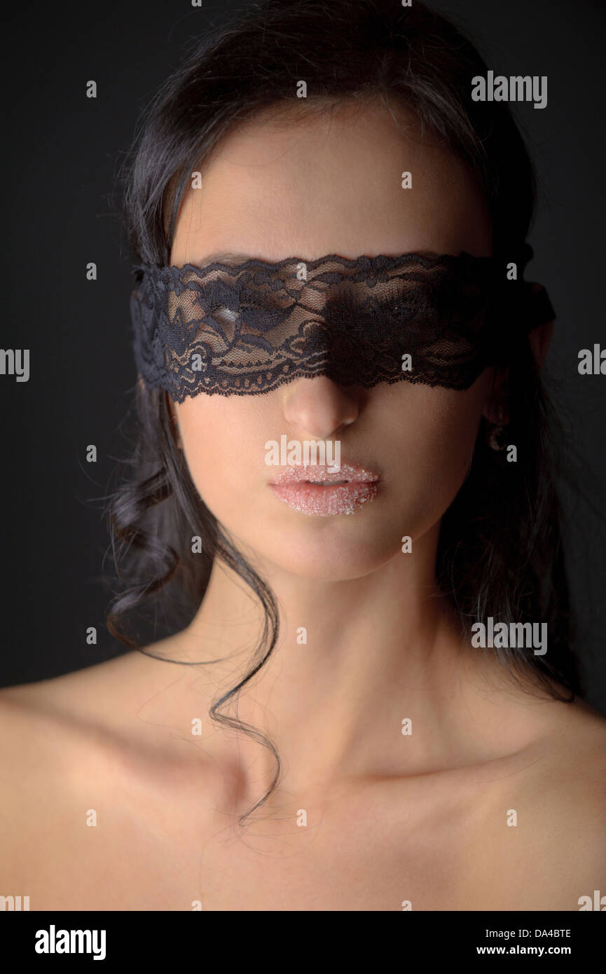 Portrait of young attractive brunnete woman with sugar on her lips Stock Photo