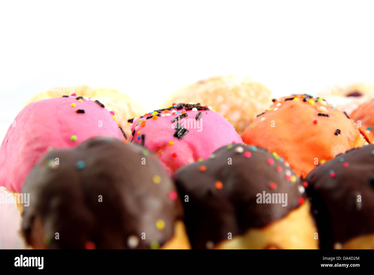 Many donuts flavor combinations on the white background. Stock Photo