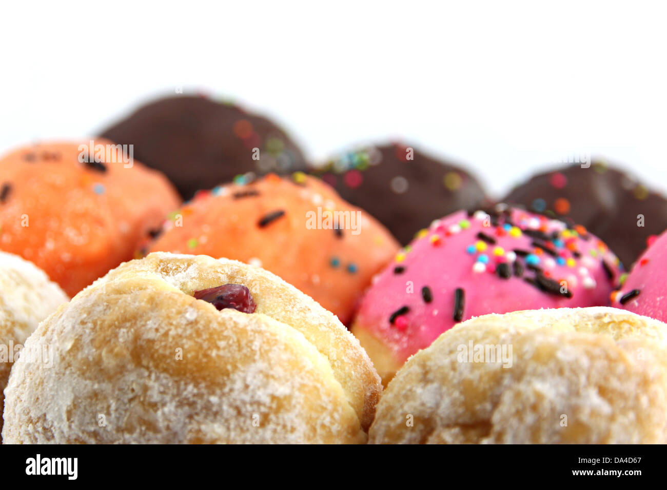 Many donuts flavor combinations on the white background. Stock Photo