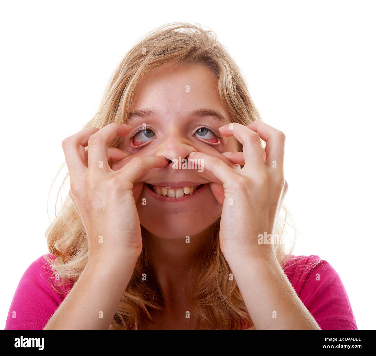 Girl Makes Funny Face In Closeup Over White Background Stock Photo Alamy