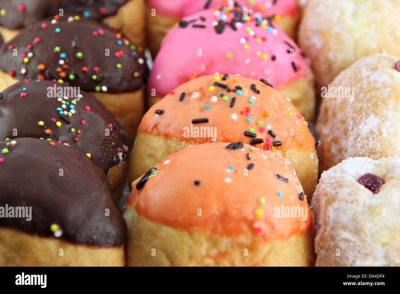 Many donuts flavor combinations on the white background. Stock Photo