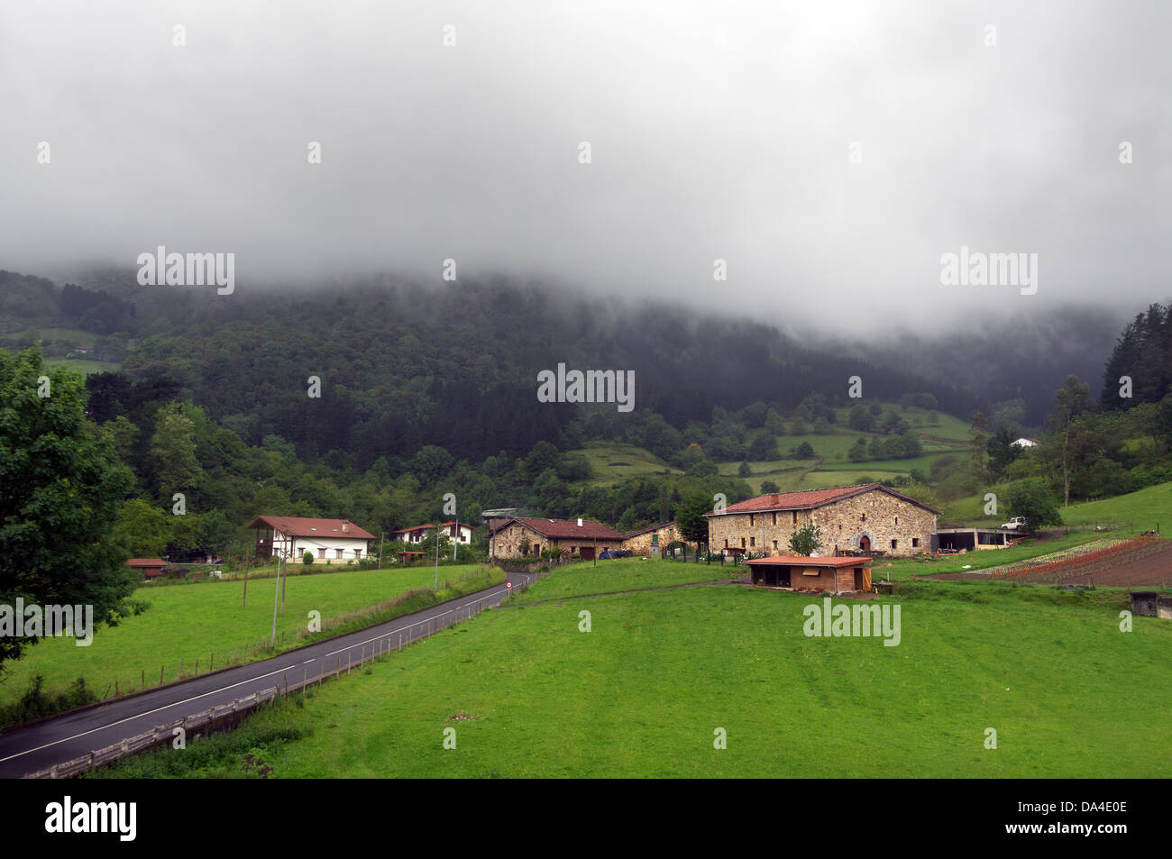Basque country village with typically basque houses and rainy weather. Taken in Axpe, Atxondo, Basque Country, Spain Stock Photo