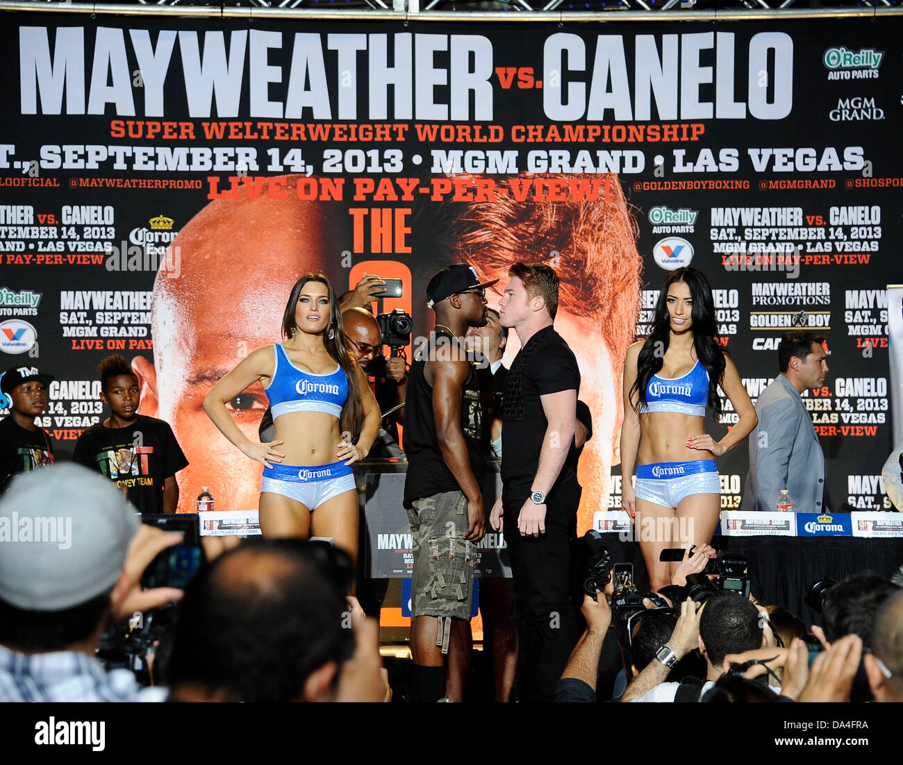 Los Angeles, USA. 02nd July, 2013. (L) Floyd ''Money'' Mayweather Jr. faces off with SaÅ“l Canelo Ã§lvarez at the Nokia Center Tuesday night on the last day of the boxing tour around the country.  The two will fight each other September 24th in Las Vegas at the MGM Grand Hotel. Photo by Gene Blevins/LA Daily News/ZumaPress/Alamy Live News Stock Photo
