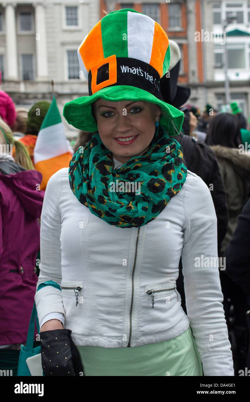 Female spectator of the St. Patrick's Parade wearing a green hat poses for a photograph, Dublin, Ireland, 17th of March 2013. Stock Photo