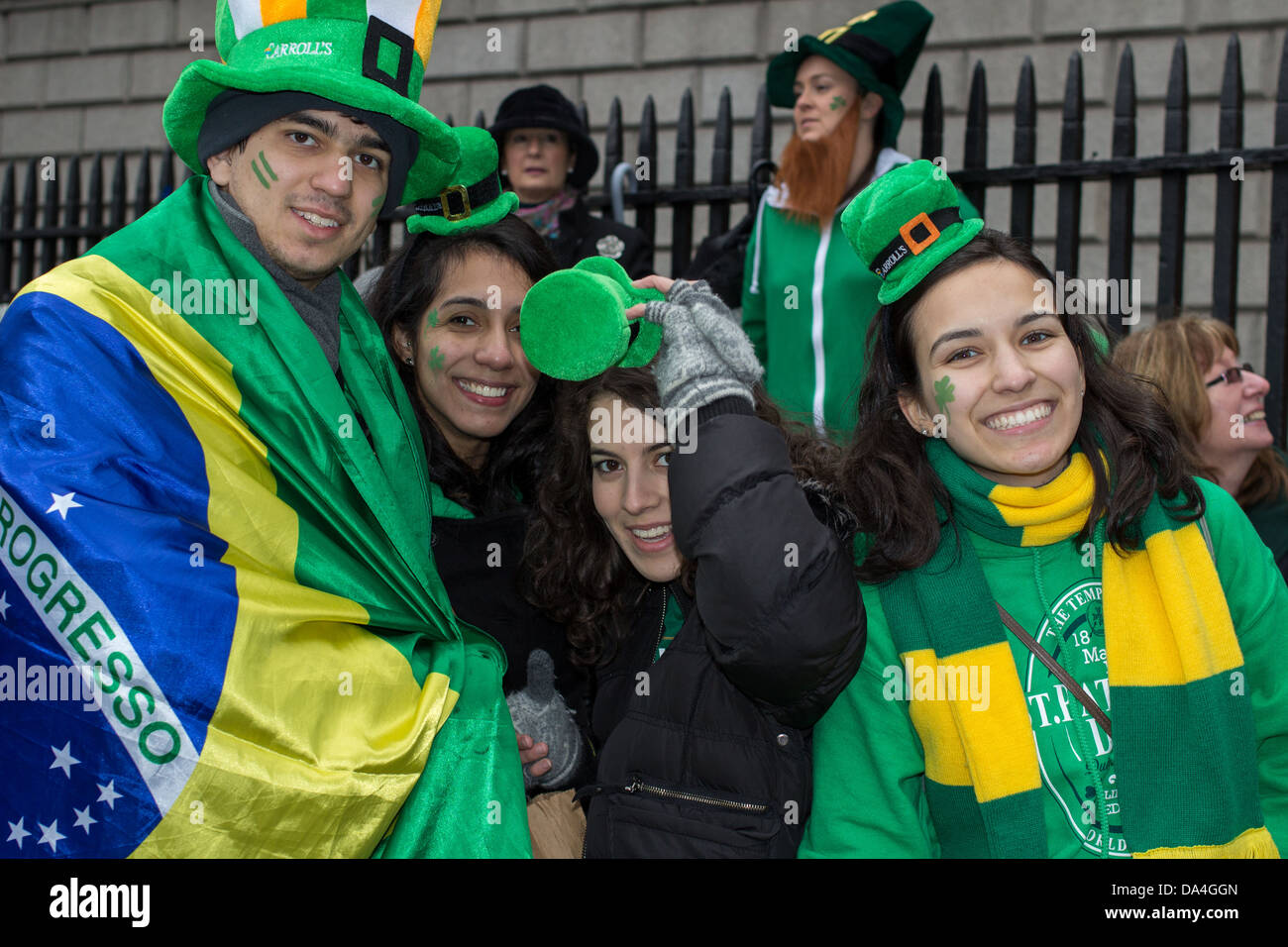 Spectators of the St. Patrick's Parade pose for a photograph, Dublin, Ireland, 17th of March 2013. Stock Photo