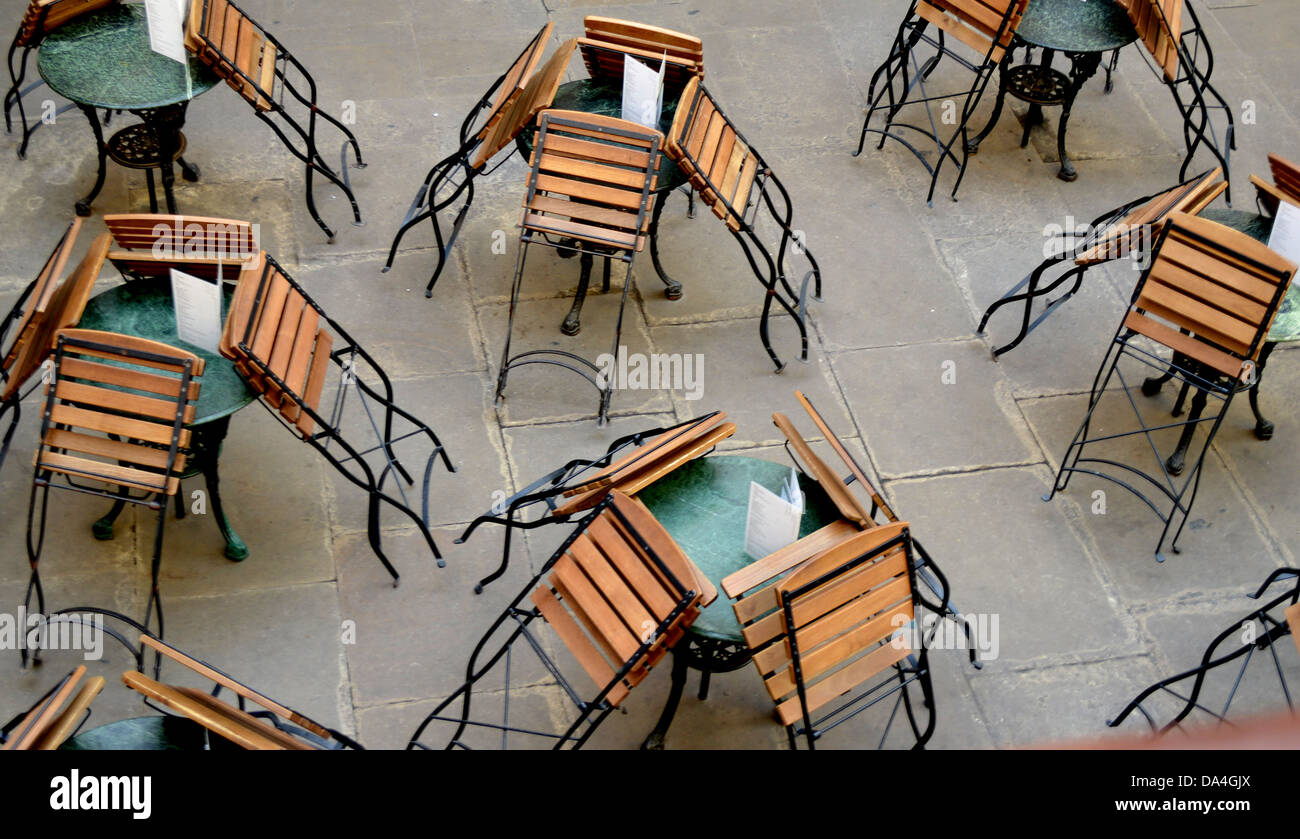 Folded chairs at an outdoor cafe in London Stock Photo