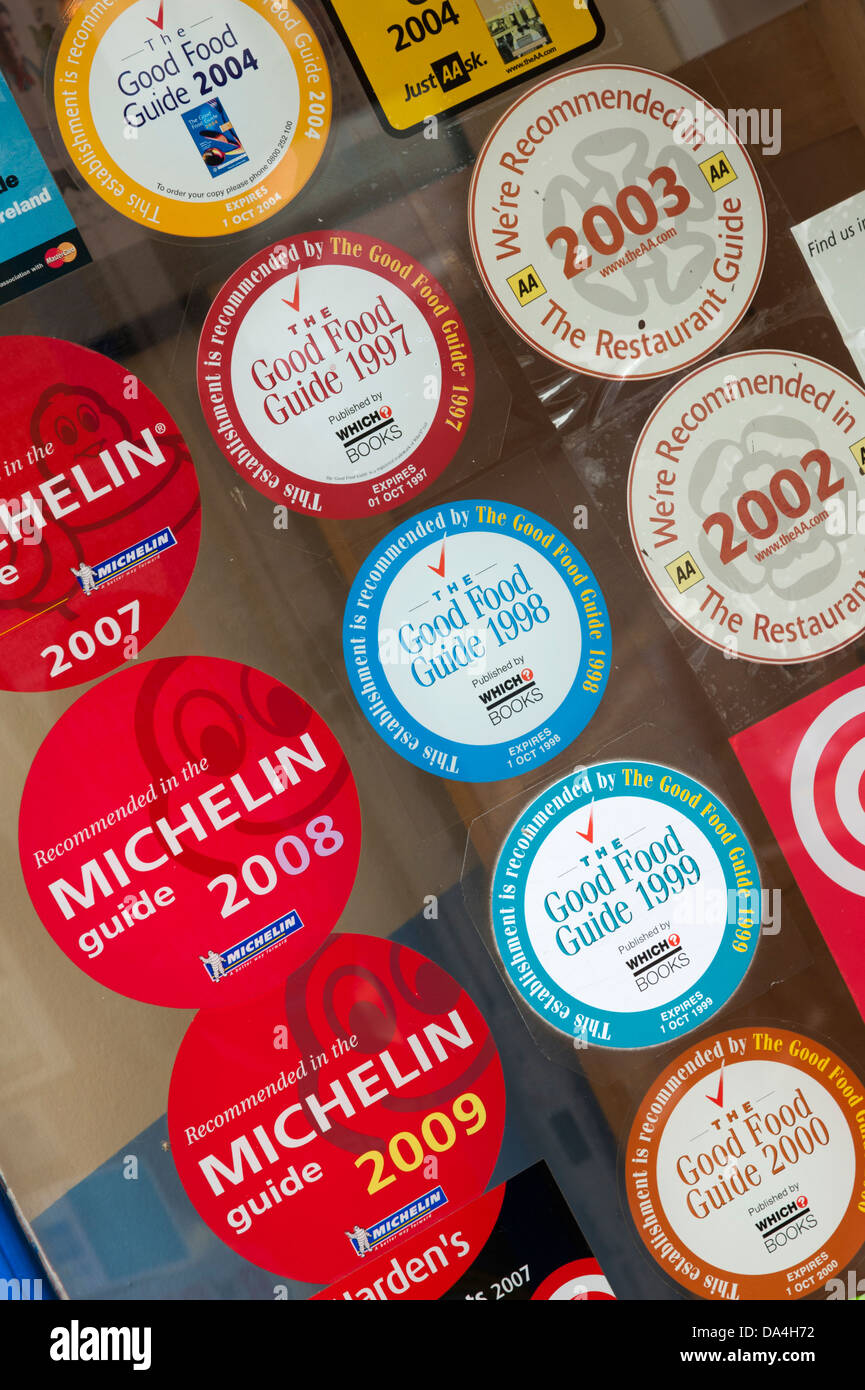 Michelin good food guide stickers in a restaurant window Stock Photo