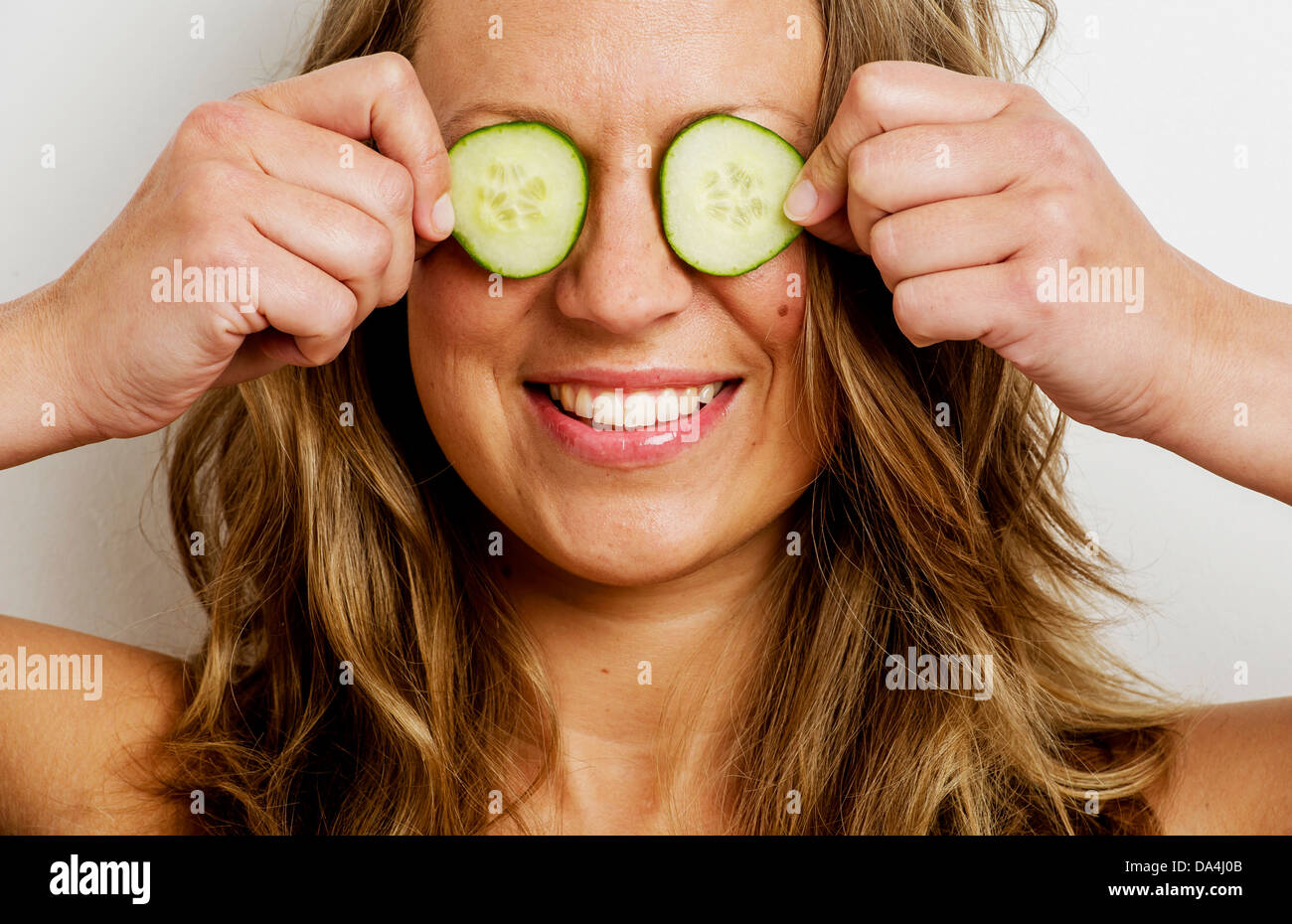 Woman with cucumber over eyes hires stock photography and images Alamy