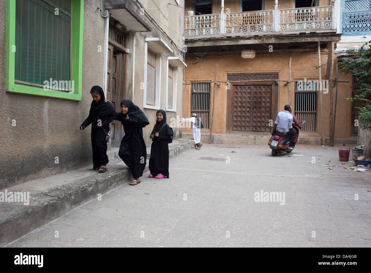 Muslim girls in the streets of Stone Town, Zanzibar - Tanzania Stock Photo