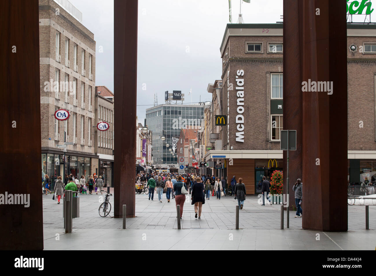 People in the busy inner city of EIndhoven with a Mc Donald's in the background, Netherlands Stock Photo