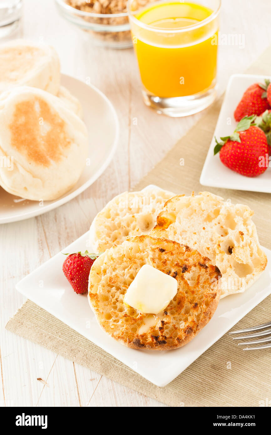 Organic Whole Wheat English Muffins with Butter Stock Photo Alamy